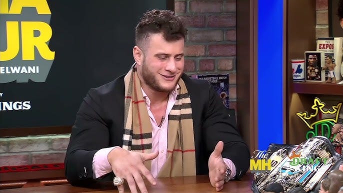 MJF on a studio set during a broadcast interview.