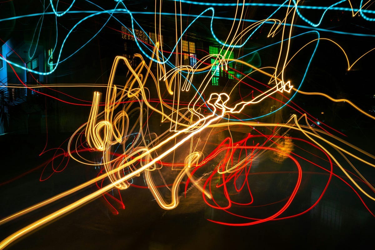 Light graffiti - chaos - photo at night in front of lights in front of a building