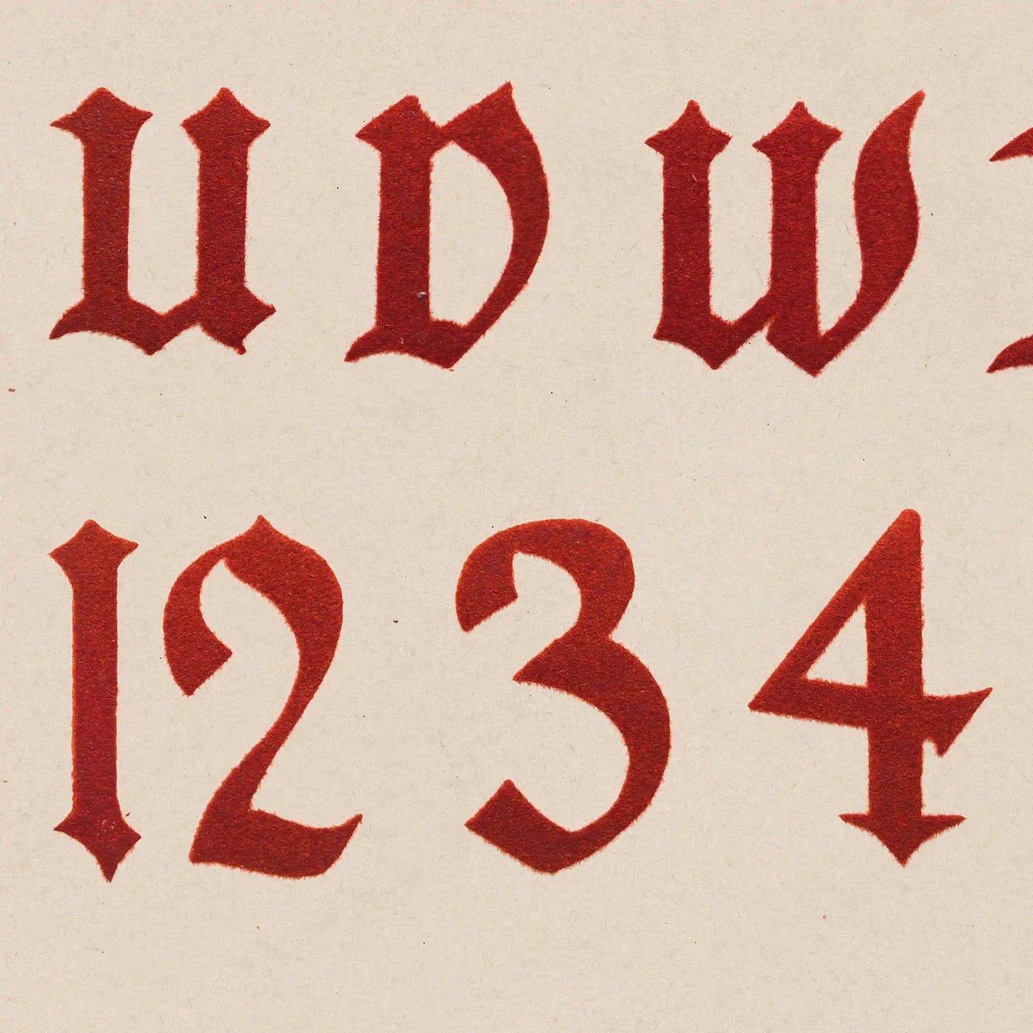 Red velvet-flocked Gothic alphabet on cream cardstock