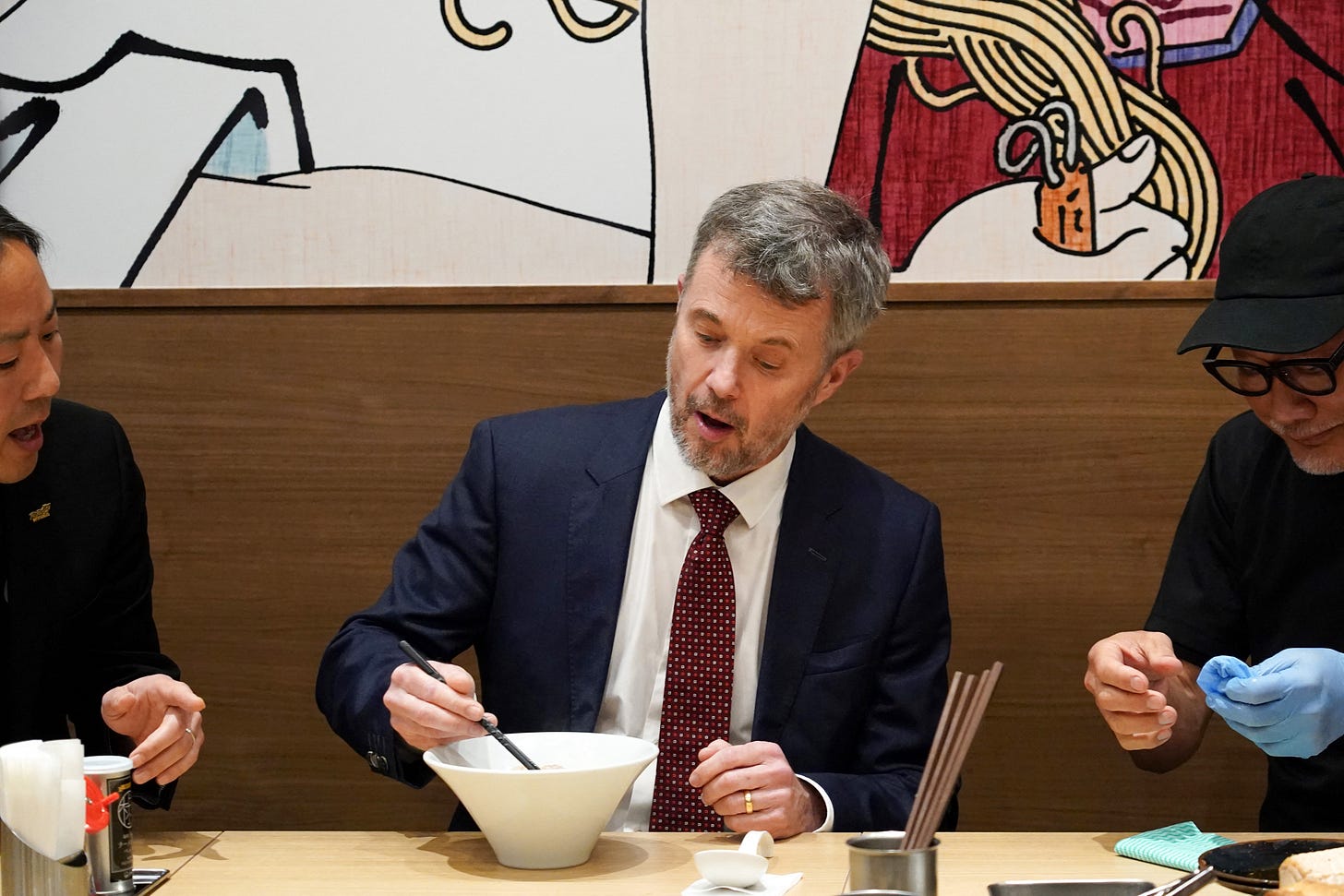 King Frederik using chopsticks in Japan