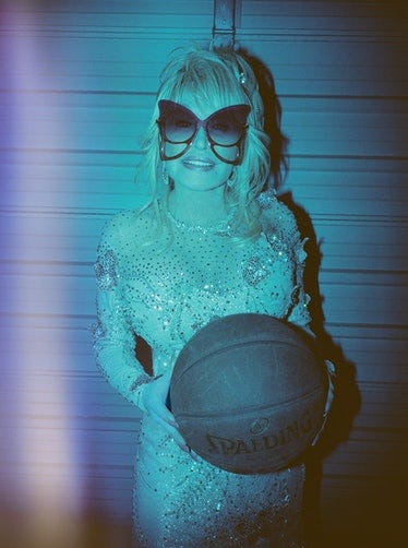 Dolly Parton wears her own custom dress by Steve Summers; Marc Jacobs sunglasses; Chopard earrings; ...