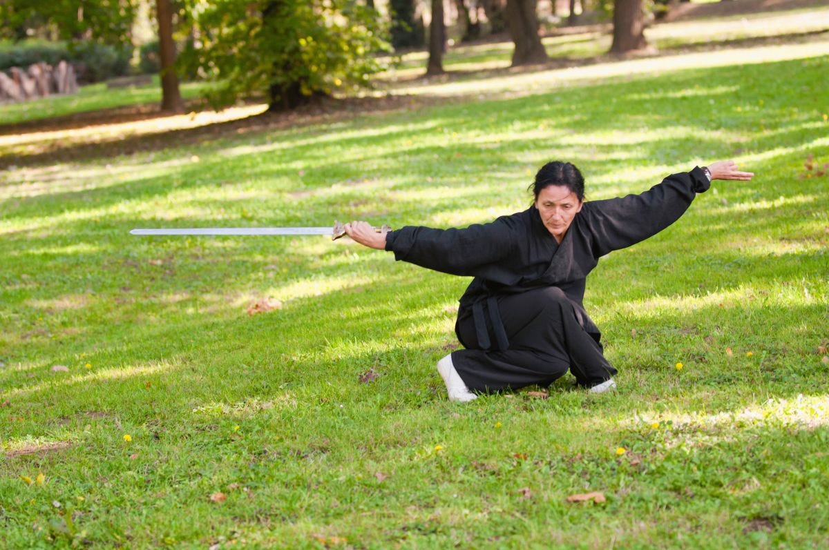 Mature female Kung Fu sword practitioner