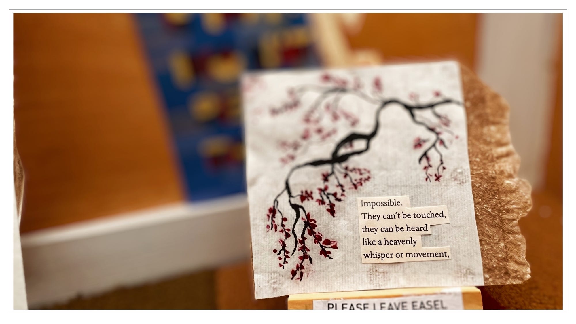 close-up of water-color painted tree limb with poem