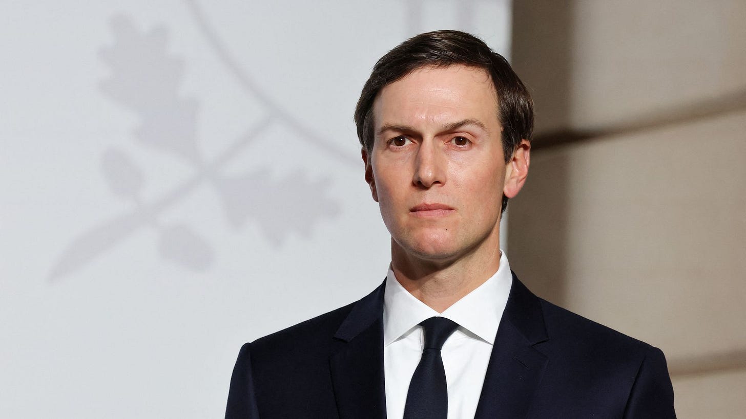 Jared Kushner in a dark suit and tie.