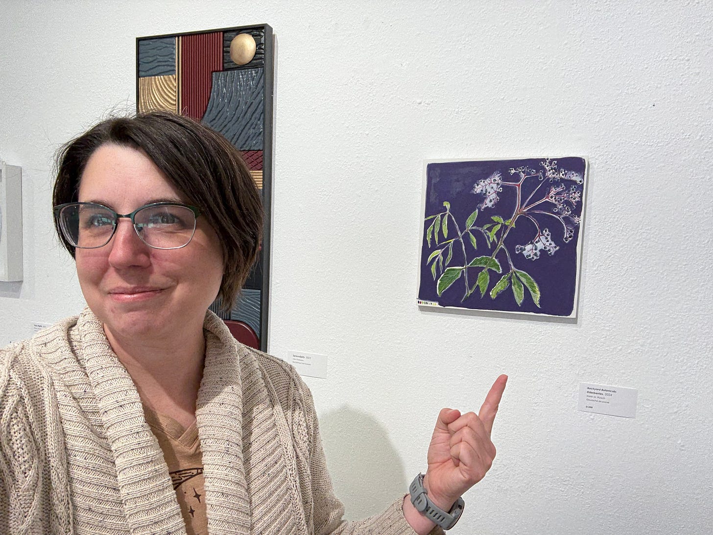 picture of me pointing to my painting at the Octagon in the community gallery picture of me pointing to my painting at the Octagon in the community gallery