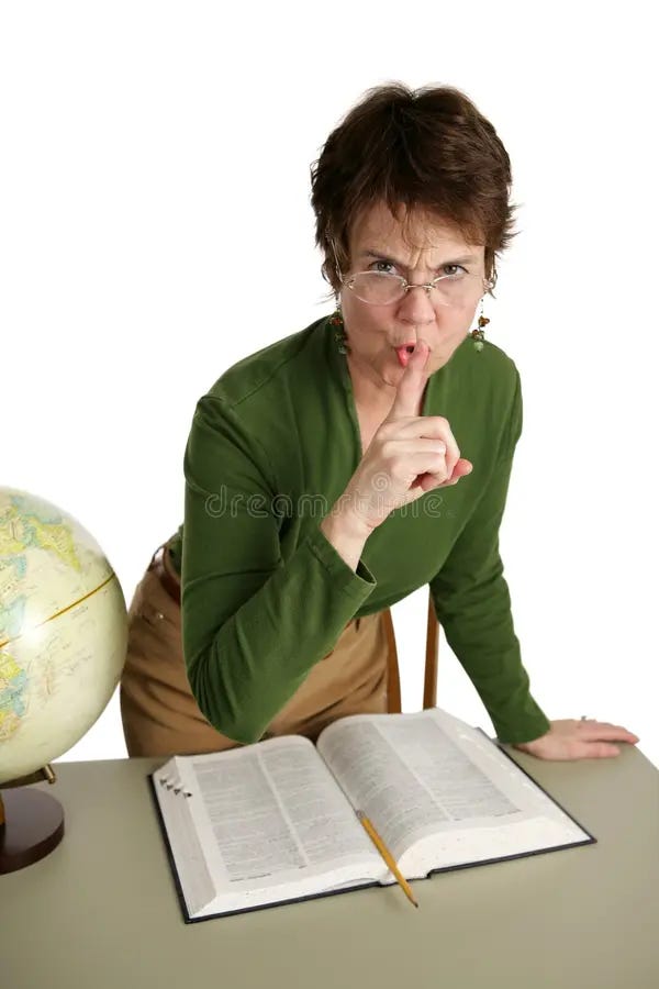 librarian shushing someone while standing over a book. this is a very good stock photo.