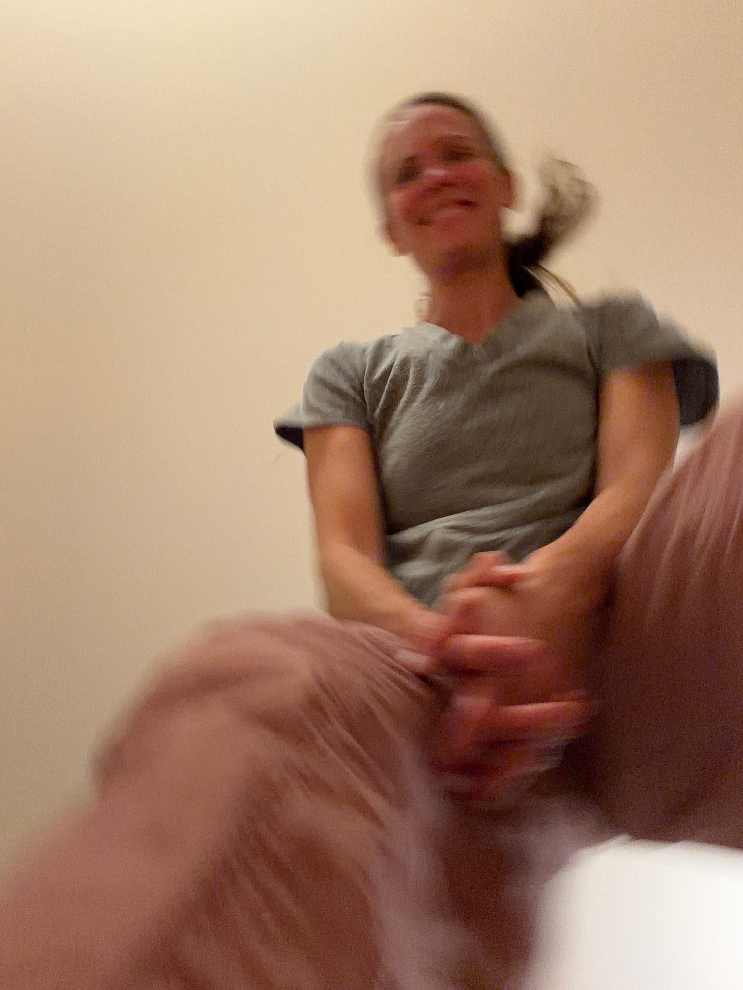 Shot from floor level looking straight up: ceiling, blurred woman moving, indoor light Shot from floor level looking straight up: ceiling, blurred woman moving, indoor light