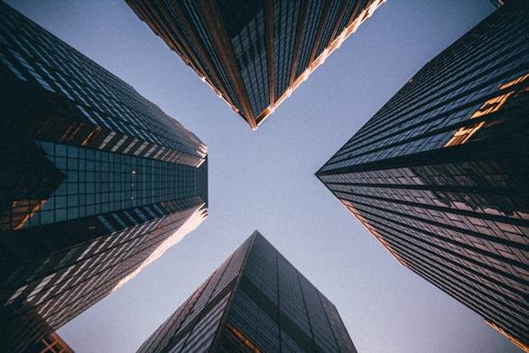low-angle photography of four high-rise buildings low-angle photography of four high-rise buildings