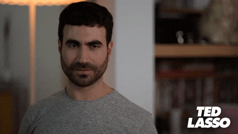 Roy Kent of Ted Lasso miming zipping his lips and throwing the key towards the camera Roy Kent of Ted Lasso miming zipping his lips and throwing the key towards the camera