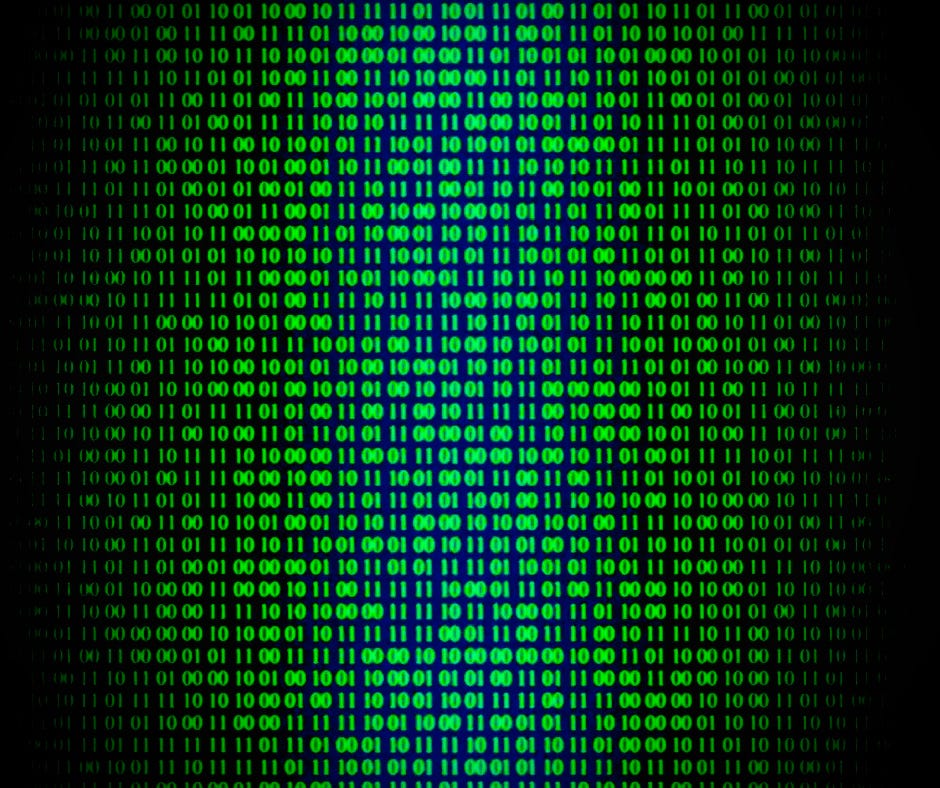 A close-up of green binary code glowing on a digital screen.