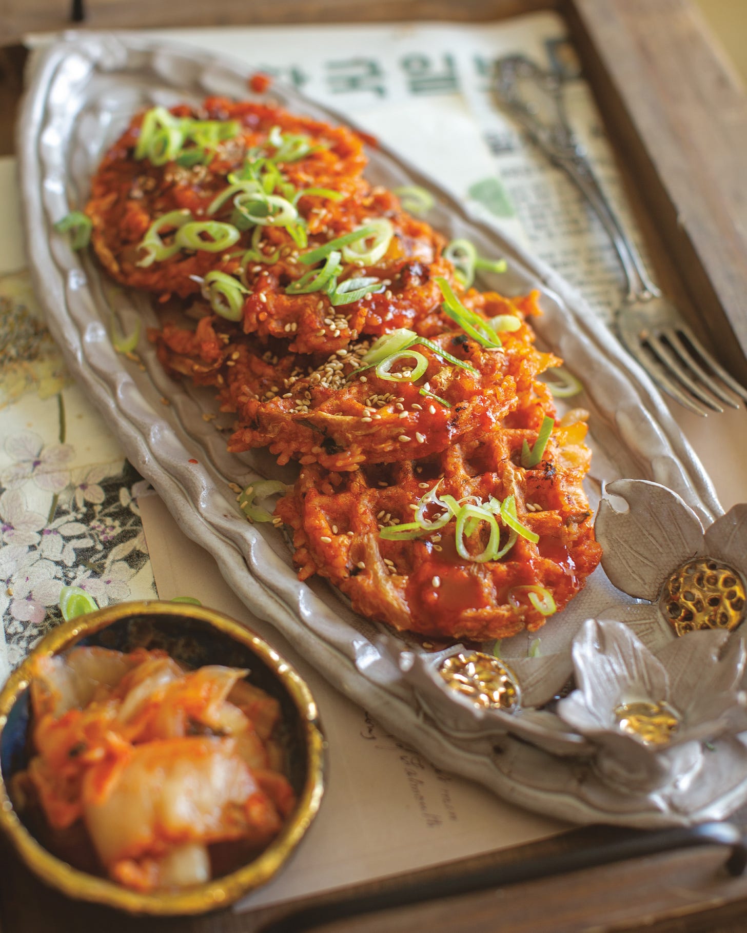 Photo of Kimchi fried rice waffles with scallions on top.