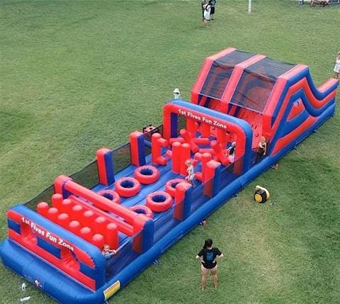A large inflatable obstacle course

Description automatically generated