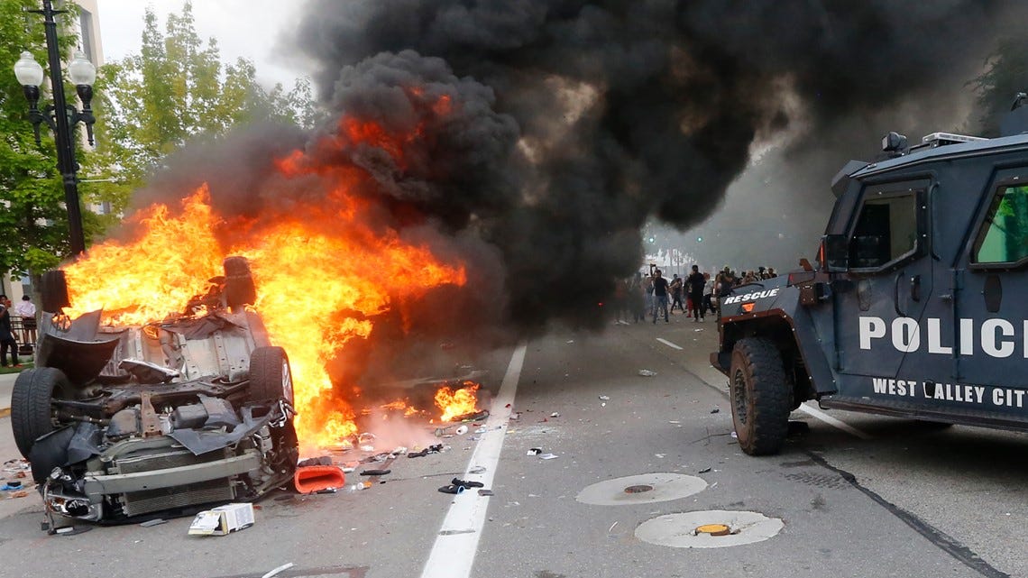 Man's car torched after he pointed bow and arrow at protesters ...