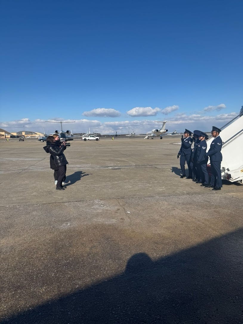 A group of people standing next to a plane

AI-generated content may be incorrect.