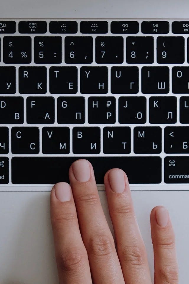 Blog rebranding A hand on a laptop keyboard