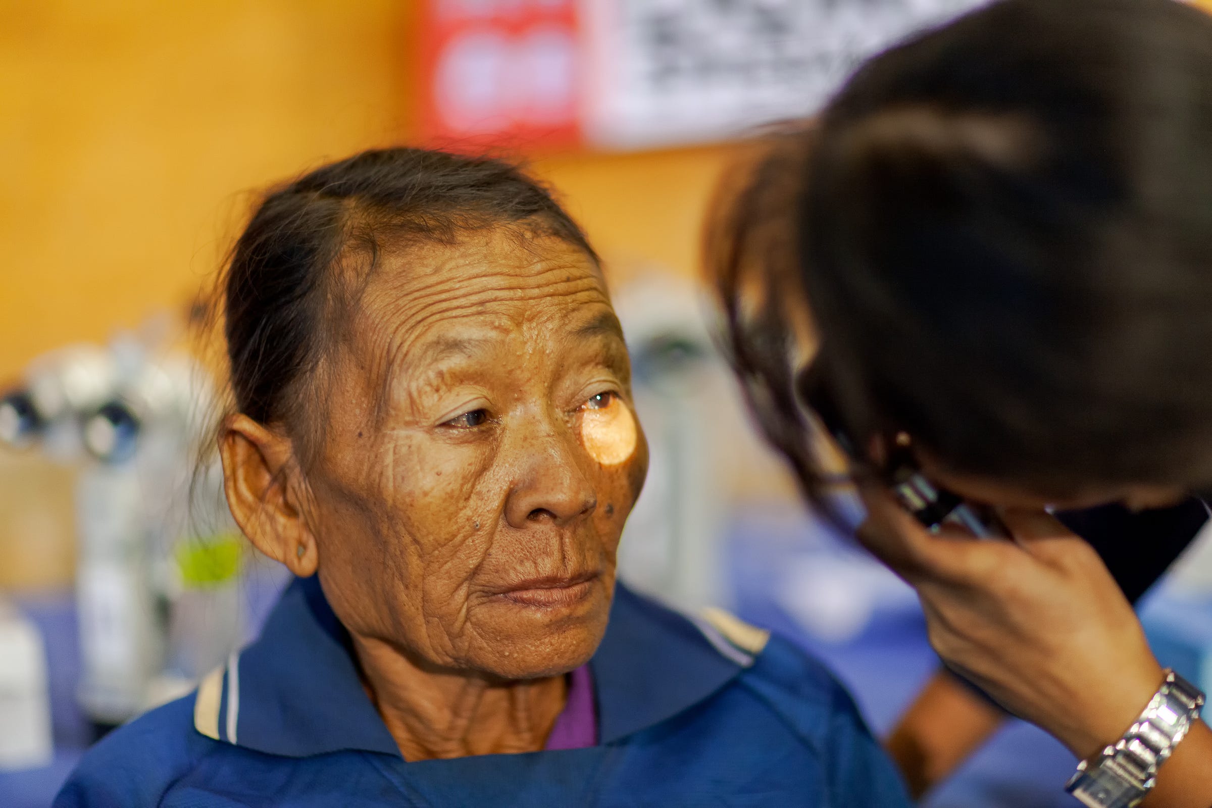 A patient being screened at a mobile eye clinic A patient being screened at a mobile eye clinic