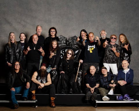 Group photo. Top row (left to right): Rex Brown; Tobias Forge; David Draiman; James Hetfield; Tony Iommi; Robert Trujillo; Phil Anselmo; Geezer Butler; Sammy Hagar; Kirk Hammett. Middle: Steven Tyler; Ozzy Osbourne. Bottom row (left to right): Mike Inez; Zakk Wylde; Bill Ward; Lars Ulrich; Billy Corgan
