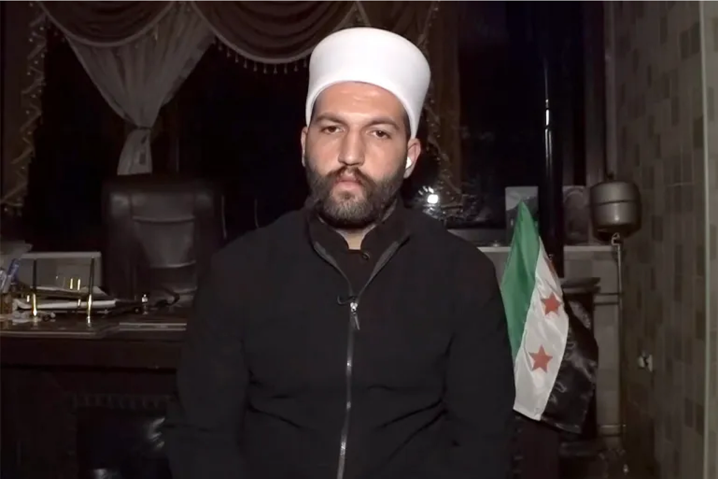 Laith al-Balhous, the Druze leader, speaking to Syrian media with the official Syrian flag behind him — a clear contrast to the narrative pushed by the single Druze figure aligned with Isael