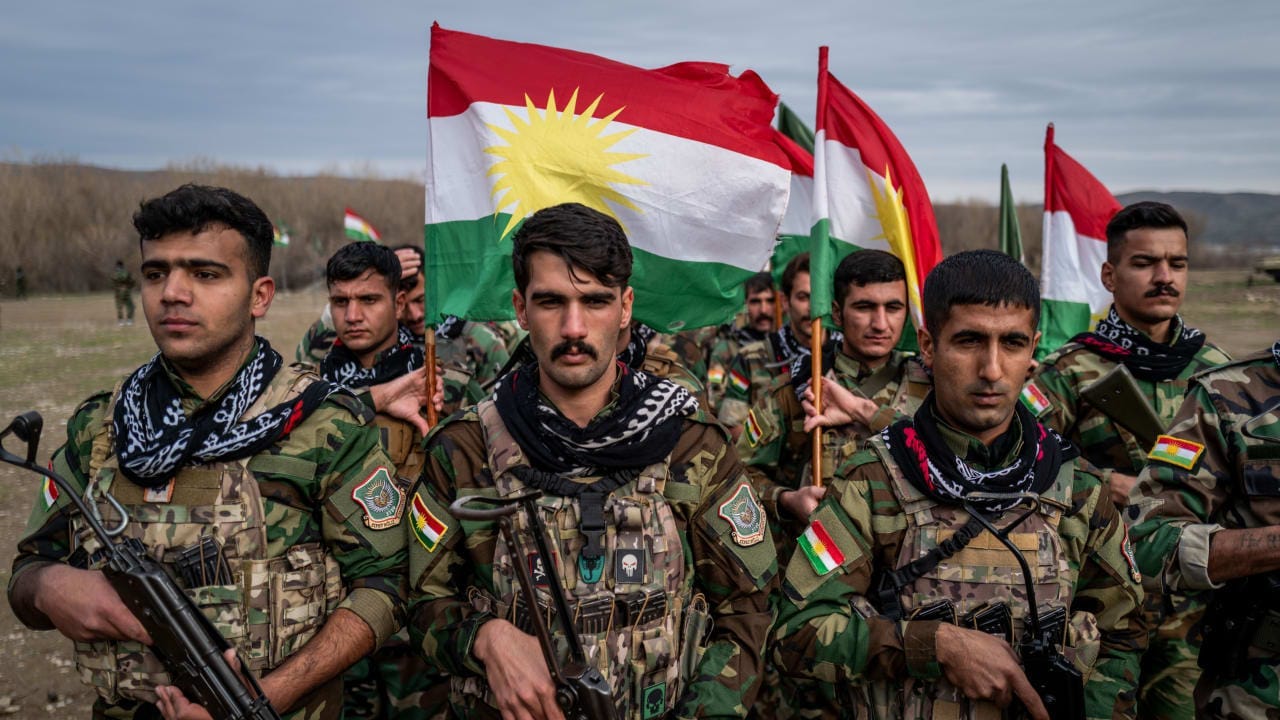 Kurdish Peshmerga fighters affiliated with PAK train on January 18, 2026 near Erbil, Iraq.