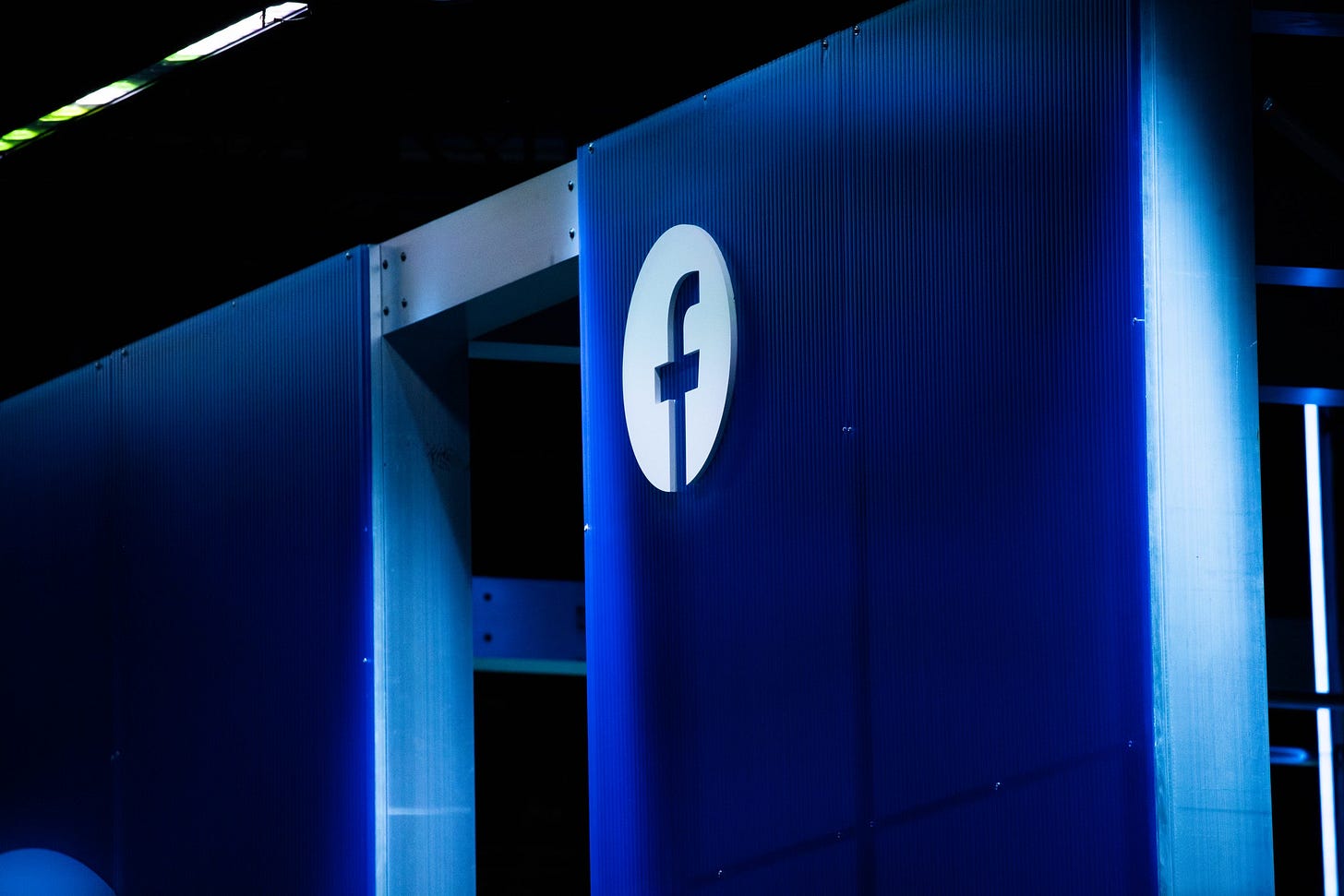 Facebook logo on wall
