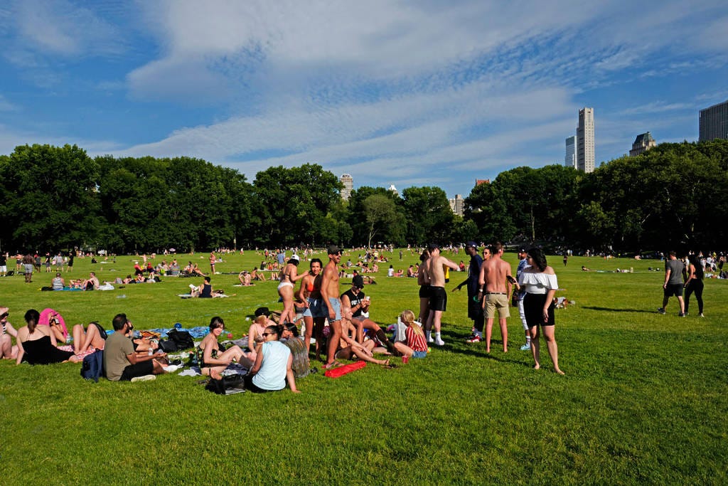 NEW YORK, UNITED STATES-JUNE 17, 2018: people gathering at Central Park on an hot summer saturday afternoon, in New York.