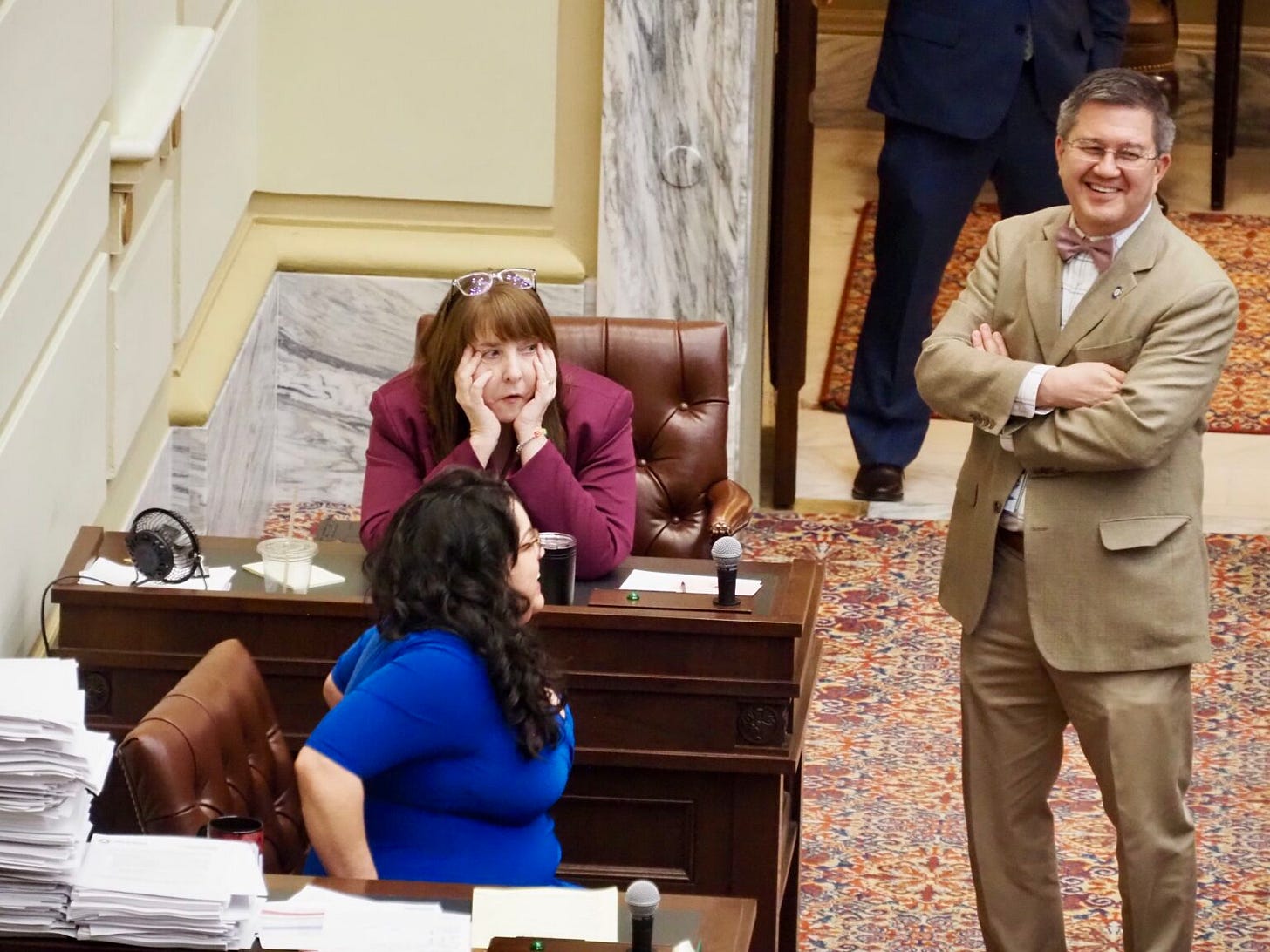 Rep. Annie Menz, D-Norman, front, talks with Sen. Mary Boren, D-Norman, and Rep. Andy Fugate, D-Oklahoma City, while awaiting votes on a veto override during the Senate session on Thursday. (Photo by Janelle Stecklein/Oklahoma Voice) Rep. Annie Menz, D-Norman, front, talks with Sen. Mary Boren, D-Norman, and Rep. Andy Fugate, D-Oklahoma City, while awaiting votes on a veto override during the Senate session on Thursday. (Photo by Janelle Stecklein/Oklahoma Voice)