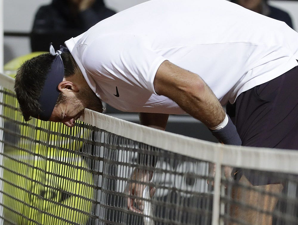 juan martin del potro suffers during novak djokovic italian open match juan martin del potro suffers during novak djokovic italian open match