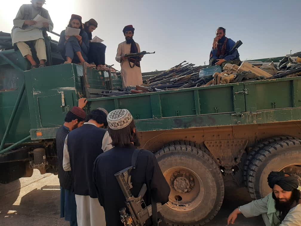 A picture containing military vehicle, person, truck, transport

Description automatically generated