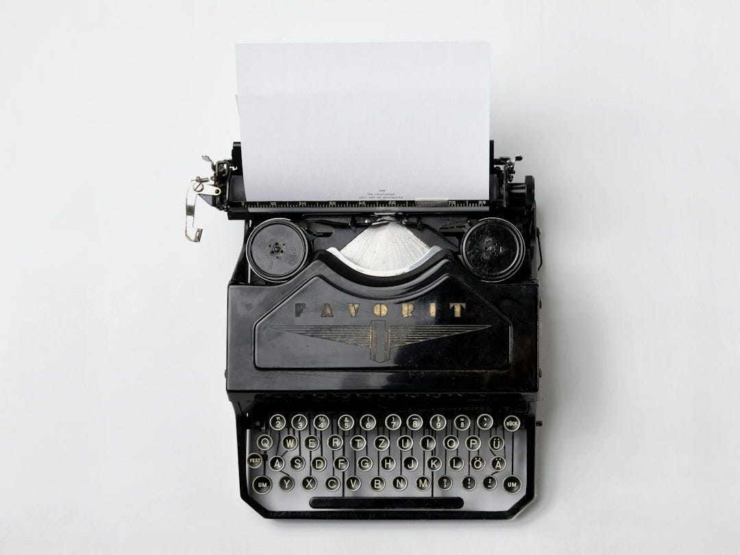 black Fayorit typewriter with printer paper black Fayorit typewriter with printer paper
