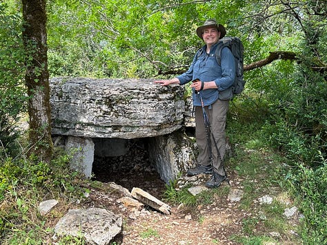 Jeffrey Keefer (at a Camino de Santiago sign in France, at my desk, and with a dolman on the Le Puy Camino)