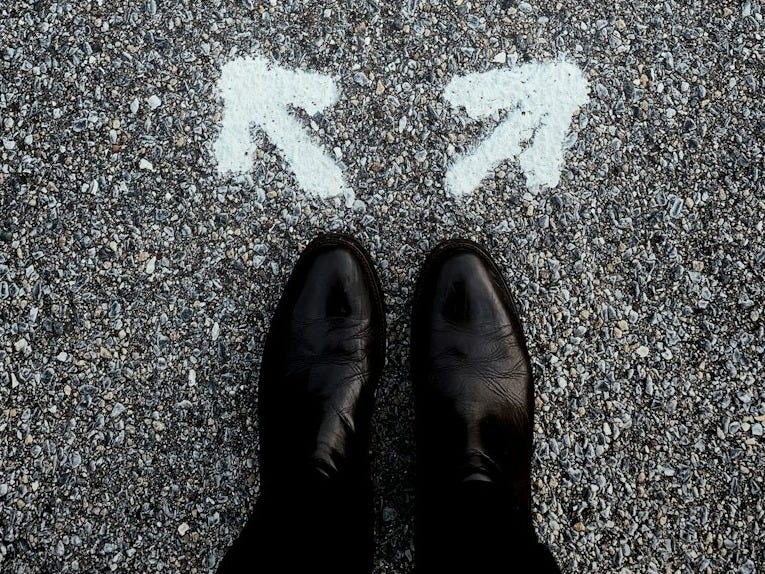 a person standing in the middle of a street a person standing in the middle of a street