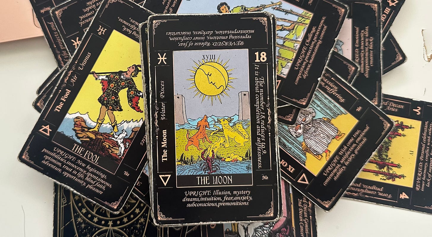 The tarot cards The Fool, The Moon, and the 7 of Wands