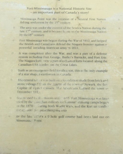 Another historical plaque with peeling letters.