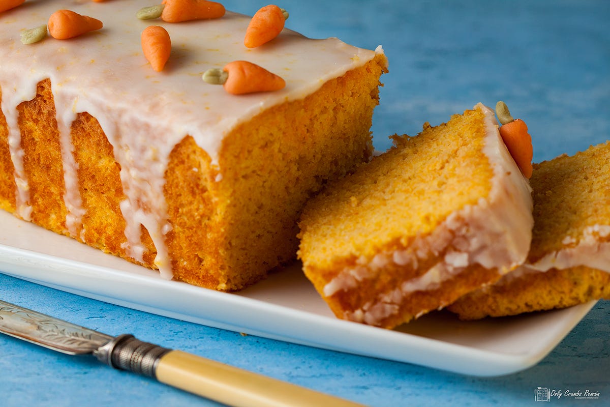 Swiss carrot cake sliced and decorated with mini fondant carrots