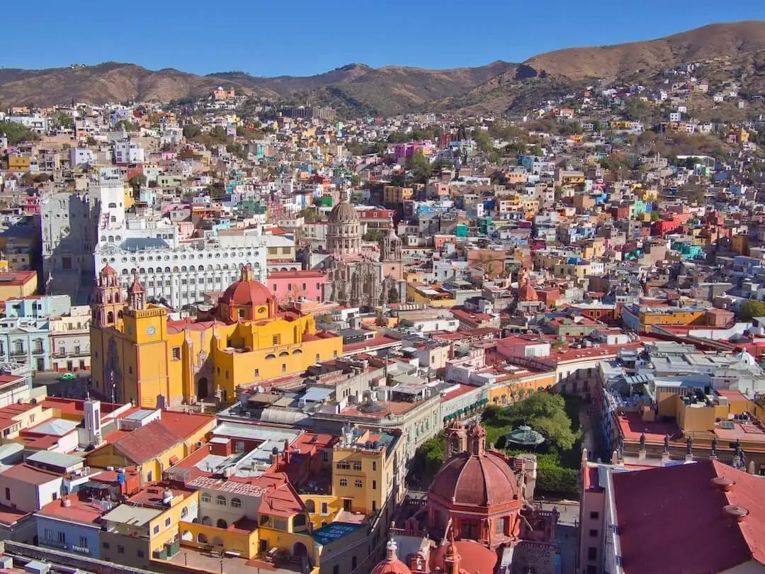 A view from above of a town with colourful buildings