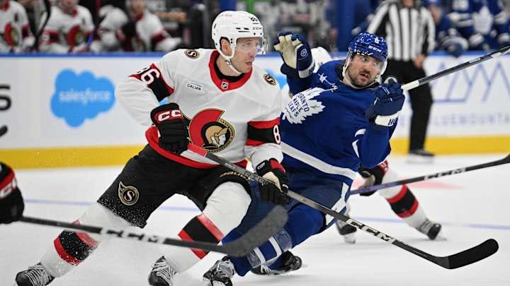 Sep 22, 2024; Toronto, Ontario, CAN; Ottawa Senators forward Nikolay Kulemin (86) knocks over Toronto Maple Leafs defenseman Chris Tanev (8) in the second period at Scotiabank Arena. Mandatory Credit: Dan Hamilton-Imagn Images Sep 22, 2024; Toronto, Ontario, CAN; Ottawa Senators forward Nikolay Kulemin (86) knocks over Toronto Maple Leafs defenseman Chris Tanev (8) in the second period at Scotiabank Arena. Mandatory Credit: Dan Hamilton-Imagn Images