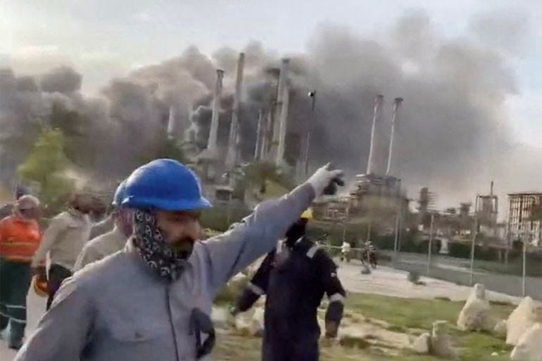 Workers evacuate area around Saudi Aramco's Ras Tanura oil refinery Workers evacuate area around Saudi Aramco's Ras Tanura oil refinery