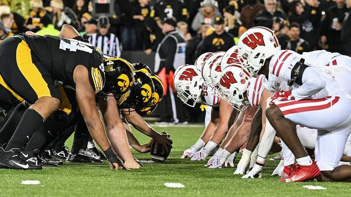 The line of scrimmage between the Iowa Hawkeyes and the Wisconsin Badgers at Kinnick Stadium. Mandatory Credit: Jeffrey Becker. The line of scrimmage between the Iowa Hawkeyes and the Wisconsin Badgers at Kinnick Stadium. Mandatory Credit: Jeffrey Becker.