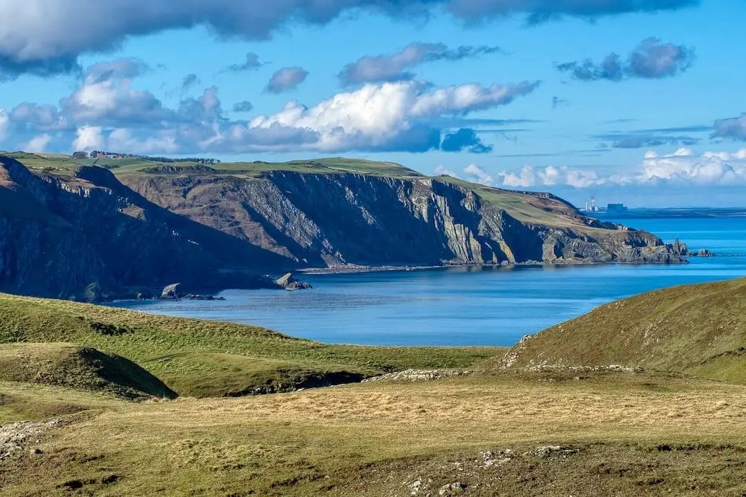 View of coastal cliffs stretching away into the distance