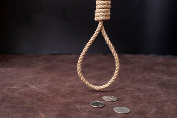 hangman"s noose hanging over 3 silver coins