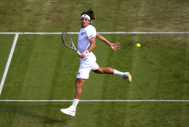 Feliciano Lopez of Spain plays backhand in his Men's Singles second round match against Karen Khachanov of Russia during Day three of The... Feliciano Lopez of Spain plays backhand in his Men's Singles second round match against Karen Khachanov of Russia during Day three of The...