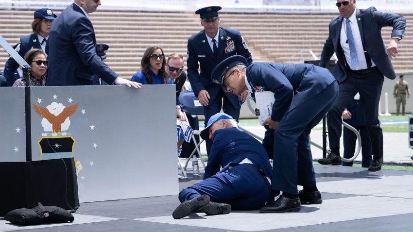 White House says Biden is fine after tripping on sandbag and falling on ...