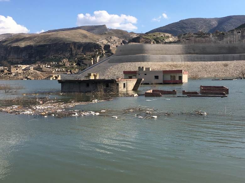 Hasankeyf floods under the concrete ramp that took its monuments.
