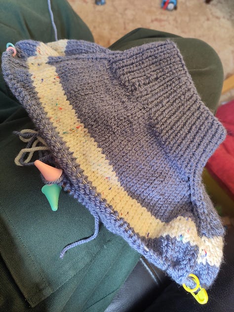 3 pictures of craft projects, a knitted jumper, a crochet blanket, and an embroidered jumper.