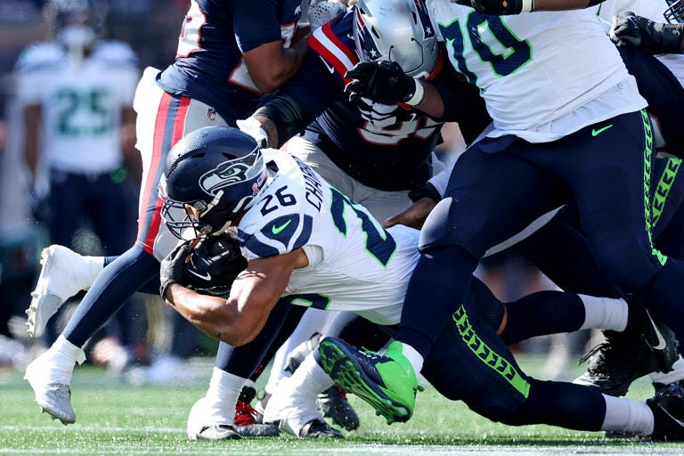 FOXBOROUGH, MASSACHUSETTS - SEPTEMBER 15: Zach Charbonnet #26 of the Seattle Seahawks dives with the ball during the second half against the New England Patriots at Gillette Stadium on September 15, 2024 in Foxborough, Massachusetts. (Photo by Adam Glanzman/Getty Images)
