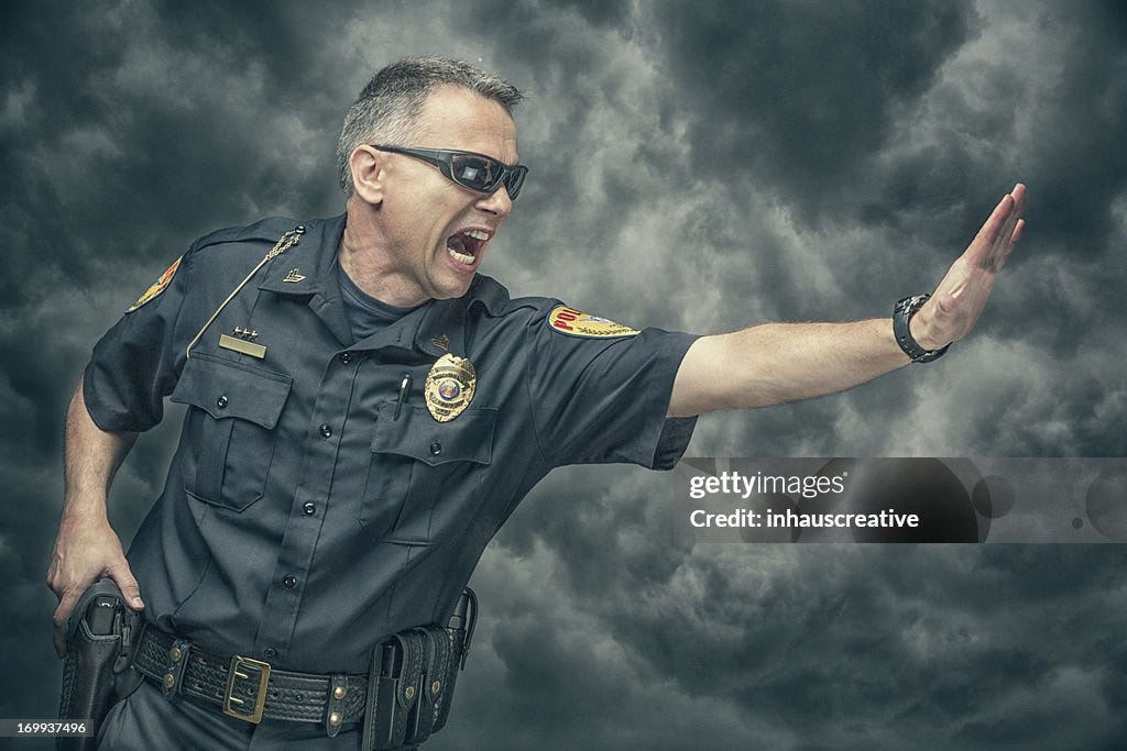 Policeman Yelling And Gesturing To Stop High-Res Stock Photo - Getty Images Policeman Yelling And Gesturing To Stop High-Res Stock Photo - Getty Images