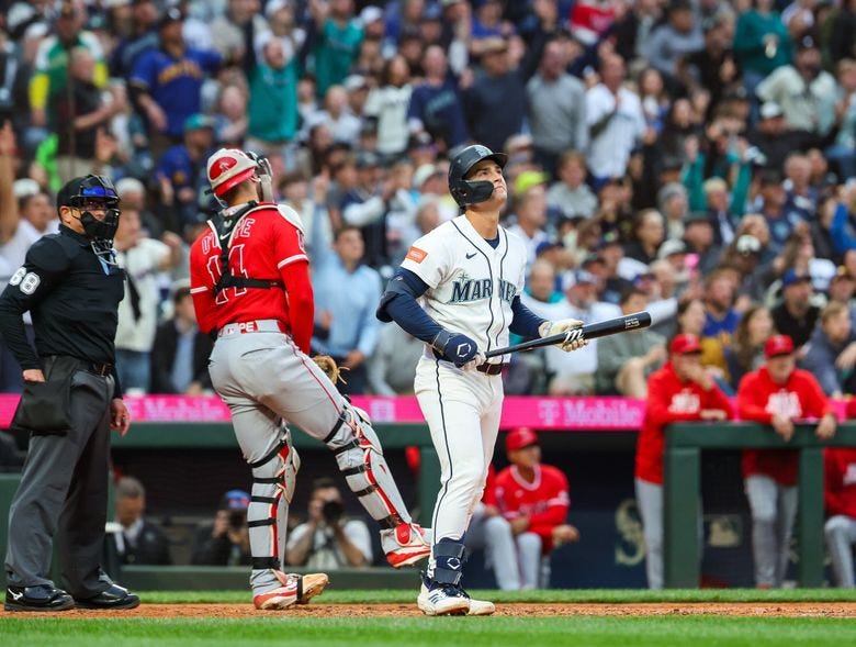 Cole Young takes a moment to watch his two-run home run in the sixth inning, his second homer of the game. (Dean Rutz / The Seattle Times)