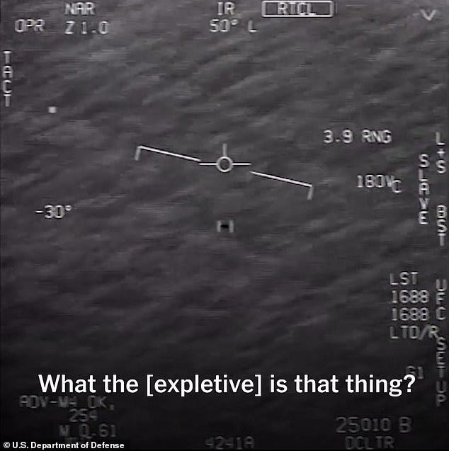 Above, a still from the 'Go Fast' UFO video - captured by Navy Pilots off the coast of Florida in 2015. Rear Adm. Gallaudet plans to testify about receiving a 'brief but alarming' official email regarding the 'Go Fast' incident that mysteriously disappeared from secured Navy servers