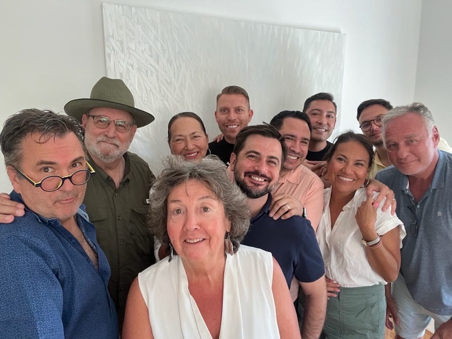 A group of people posing for a photo

Description automatically generated