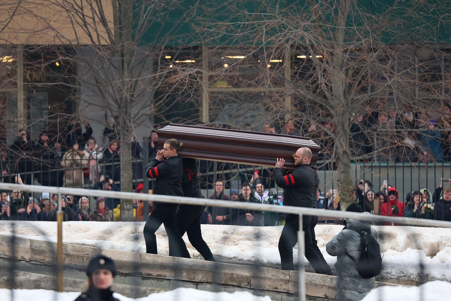 Pallbearers carry the coffin of late Russian opposition leader Alexei Navalny into the Mother of God Quench My Sorrows church for his funeral service, in Moscow's district of Maryino on March 1